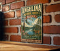 A vintage-style metal sign for the Angelina National Forest in Texas, featuring a scenic illustration of a forest and a lake.