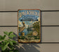 A vintage-style metal sign for the Apalachicola National Estuarine Research Reserve in Florida, featuring a pelican and a ship on a body of water.
