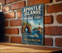 A vintage-style metal sign for the Apostle Islands National Lakeshore Marine Zone in Wisconsin, featuring a lighthouse and a boat on the water.