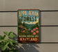 A vintage metal sign for the Appalachian Forest National Heritage Area in Maryland, featuring a scenic landscape with a bird and flowers.