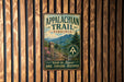 A vintage metal sign for the Appalachian Trail in Virginia, featuring a scenic mountain landscape and the trail's name.