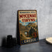 A vintage-style metal sign advertising "Archaeological Sites of Mycenae and Tiryns" in Greece, featuring an illustration of an ancient Greek city.