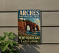 A vintage-style sign for the Arches Provincial Park in New Brunswick and Labrador, featuring a scenic landscape with a large rock formation and a body of water.