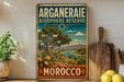 a vintage-style sign for the Arganderaie Biosphere Reserve in Morocco, with a scenic landscape and text indicating the reserve's location.
