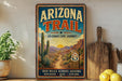 A vintage-style poster advertising the Arizona Trail, featuring a desert landscape with cacti and mountains in the background.
