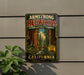 A vintage-style metal sign for the Armstrong Redwoods State Natural Reserve in California, featuring a scenic illustration of the redwood forest.