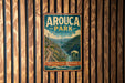 A vintage metal sign for Arouca Park in Portugal, featuring a scenic mountain landscape with a bridge and a river.