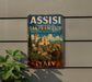 A vintage-style metal sign with the text "ASSISI THE BASILICA OF SAN FRANCISCO AND OTHER FRANCICAN SITES ITALY" and an illustration of a person in a robe and hat.
