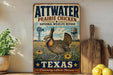 A vintage-style metal sign with the text "ATWATER PRAIRIE CHICKEN" and "NATIONAL WILDLIFE REFUGE" is displayed on a shelf, accompanied by a wooden cutting board and a potted plant.