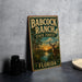 A vintage-style metal sign for Babcock Ranch State Forest in Florida, featuring an illustration of a deer in a forest setting with palm trees and a sunset.