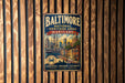 A vintage metal sign for the Baltimore National Heritage Area in Maryland, featuring a ship and a cityscape, is displayed on a wooden wall.