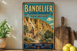 A vintage-style metal sign for the National Monument in New Mexico, featuring a desert landscape with a mountain in the background.