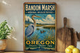 A vintage-style metal sign for Bandon Marsh National Wildlife Refuge in Oregon, featuring an illustration of a heron and a lake with ducks.