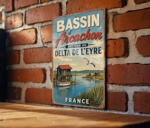 A vintage-style metal sign with the text "BASSIN de Arcachon" and "DELTA DE L'EYRE" is displayed on a brick wall.