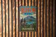 A vintage-style metal sign with the text "BATUR PARK INDONESIA" is displayed on a wooden wall.