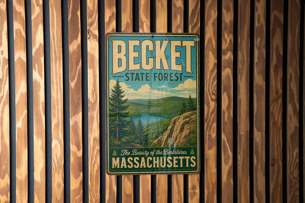 A vintage metal sign for Becket State Forest in Massachusetts, featuring a scenic landscape with pine trees and a lake.