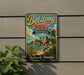 A vintage-style metal sign for Belitong Park in Indonesia, featuring a tropical beach scene with palm trees and rocks.