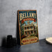 A vintage-style metal sign for Bellamy mansion in Wilmington, North Carolina, featuring an illustration of the mansion and the text "Bellamy mansion" in a decorative font.
