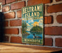 A vintage metal sign for Beltrami Island, Minnesota, featuring a scenic landscape with a lake, trees, and a duck.