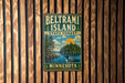 A vintage metal sign for Beltrami Island, Minnesota, featuring a scenic landscape with a lake, trees, and a bird.