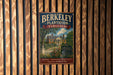 A vintage-style metal sign for Berkeley Plantation, Virginia, featuring a house and trees in a wooded setting.
