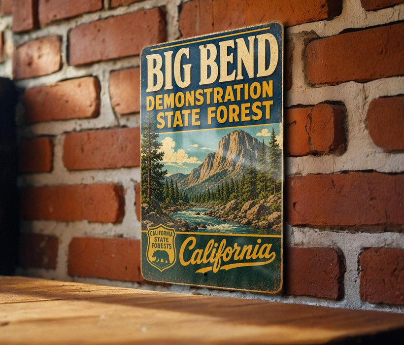 A vintage metal sign for the Big Bend State Forest in California, featuring a scenic mountain landscape and the text "Big Bend" prominently displayed.