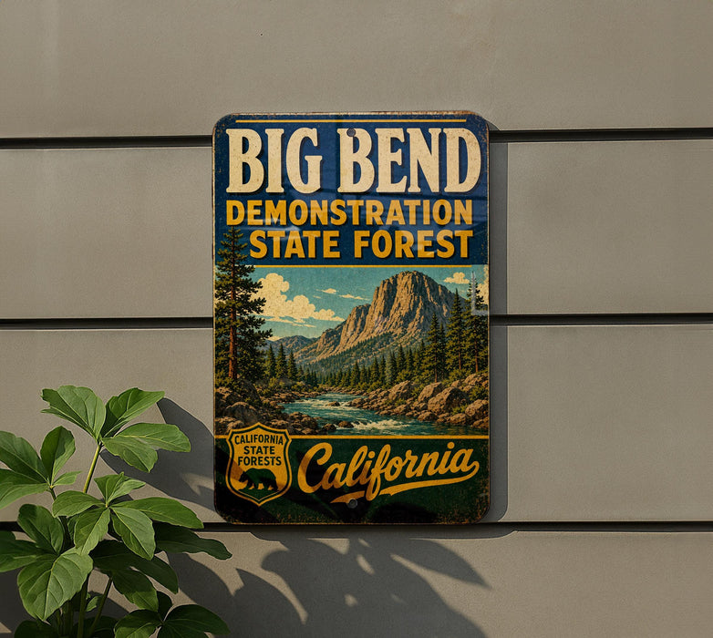 A vintage metal sign for the Big Bend State Forest, featuring a scenic mountain landscape with a river and pine trees.