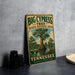 A vintage-style sign for the Big Cypress Tree State Natural Area in Tennessee, featuring a large cypress tree and the text "Home of the Big Cypress Tree" and " Tennessee Experience Protect Enjoy".