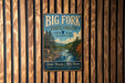 A vintage metal sign for Big Fork State Forest in Minnesota, featuring a scenic illustration of a forest and a river.