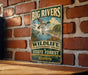 A vintage-style metal sign for the Big Rivers Wildlife Management Area in Kentucky, featuring a duck and deer in a natural setting.