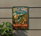 A metal sign on a wall that says " Billy Goat Trail Maryland" and features an illustration of a goat on a mountain.