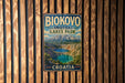 A vintage metal sign for Biokovo Imotski Lakes Park in Croatia, featuring a scenic mountain landscape with a lake in the foreground.