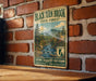 A vintage metal sign for Black Turn Brook State Forest in Vermont, featuring a scenic mountain landscape and a river.