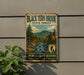 A vintage-style metal sign for Black Turn Brook State Forest in Vermont, featuring a scenic image of a forest with a river and mountains in the background.