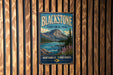 A vintage-style metal sign for Blackstone Territorial Park, featuring a mountain landscape with a river and pine trees.