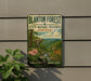 A vintage-style metal sign for Blanton Forest State Nature Preserve in Kentucky, featuring a scenic landscape with a deer and flowers.