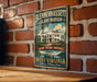 A vintage-style metal sign for Blennerhaslett Island mansion in West Virginia, featuring an illustration of the mansion and a river.