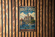 A vintage metal sign for Boldt Castle, New York, featuring a castle illustration and the text "Heart of the 1000 Islands" and "A Place of Romance & History".