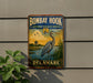 A vintage-style metal sign for the Bombay Hook National Wildlife Refuge in Delaware, featuring an illustration of a heron in a grassy area with a body of water.