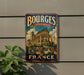 A vintage metal sign with the word "BOURGES" and "CATHEDRAL FRANCE" on it, featuring an illustration of a cathedral.