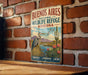 A vintage-style sign for the Buenos Aires National Wildlife Refuge in Arizona, featuring a bird, cactus, and desert landscape.