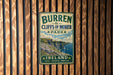 A vintage metal sign for Burren Cliffs of Moher Park in Ireland, featuring a scenic illustration of the cliffs and the surrounding landscape.
