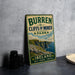 A vintage metal sign advertising Burren and Cliffs of Moher Park, featuring a scenic illustration of cliffs overlooking the ocean.