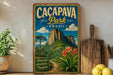 a vintage-style poster of the Cacapava Park in Brazil, with a mountainous landscape and tropical flora.
