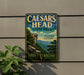 a vintage-style metal sign for Caesars Head State Park in South Carolina, with a scenic mountain landscape and a cliff on the left side.