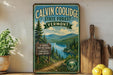 A vintage-style metal sign for Calvin Coolidge State Forest in Vermont, featuring a scenic landscape with a lake and mountains.