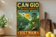 a vintage-style sign for the Can Gio Mangrove Bioscape Reserve in Vietnam, with a monkey and a boat in the background.