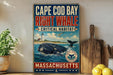 A vintage-style sign for Cape Cod Bay, Massachusetts, featuring a whale and a lighthouse, with the text "Cape Cod Bay Right Whale Critical Habitat" and "Massachusetts" at the bottom.