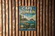 A vintage metal sign for Cape Romain, a marine protected area in South Carolina, featuring a lighthouse and marine life.