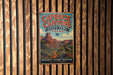 A vintage metal sign for Caprock Canyon State Park in Texas, featuring a desert landscape with a mountain and a ram.